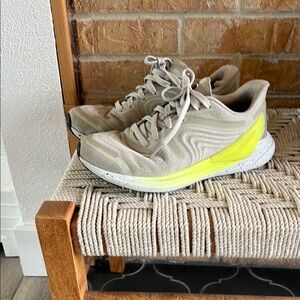 Cream and Yellow Athletic Shoes with Modern Design